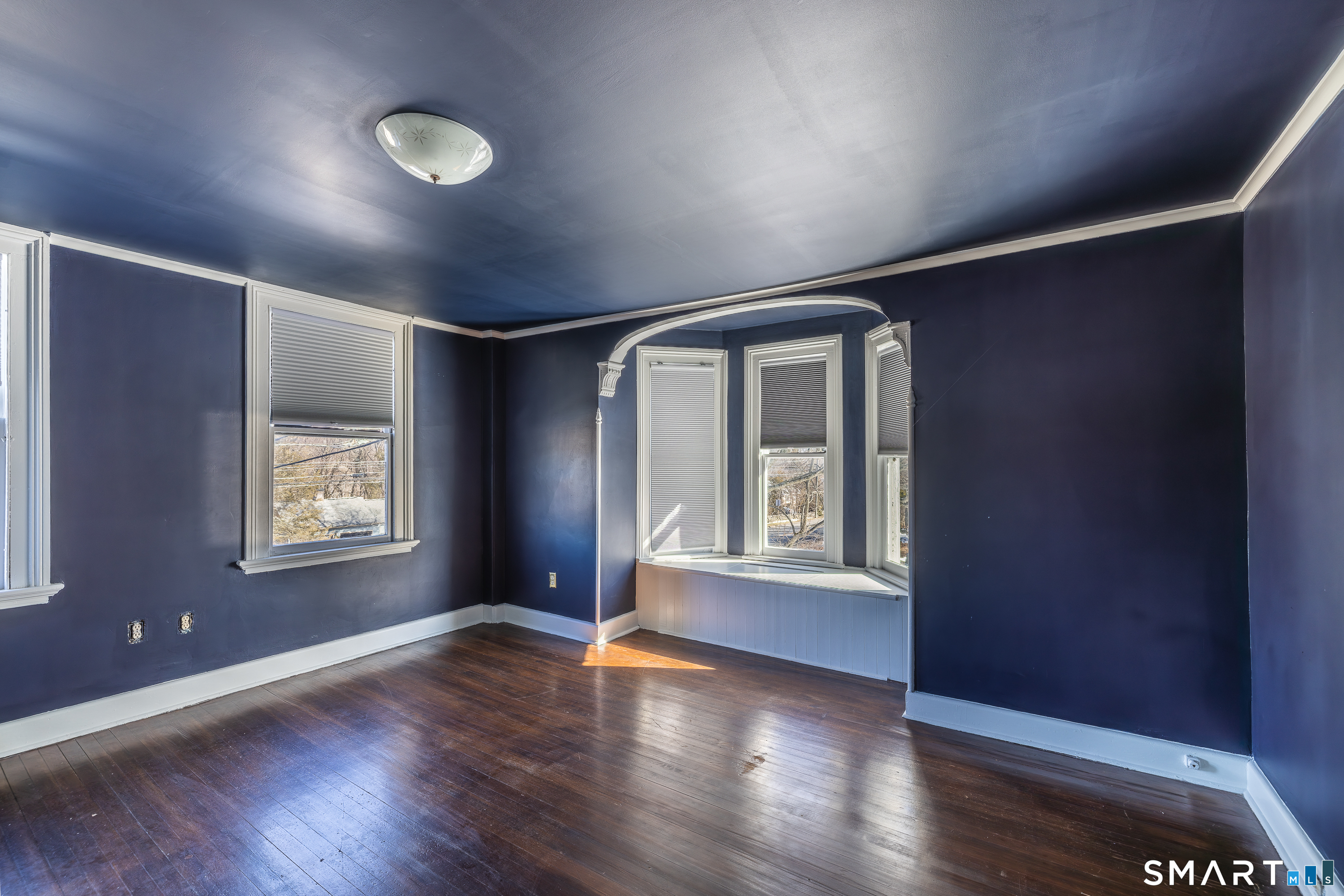 5385 Main Street Trumbull, CT 06611 - Photo 22 of 39 a view of an empty room with wooden floor and a window