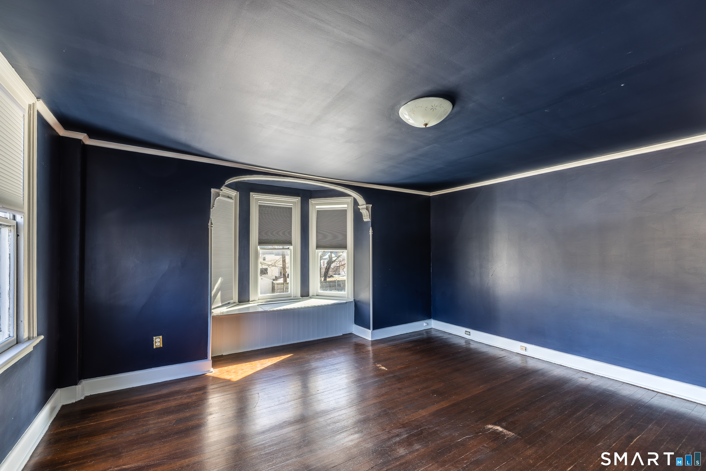 5385 Main Street Trumbull, CT 06611 - Photo 23 of 39 a view of an empty room with wooden floor and a window