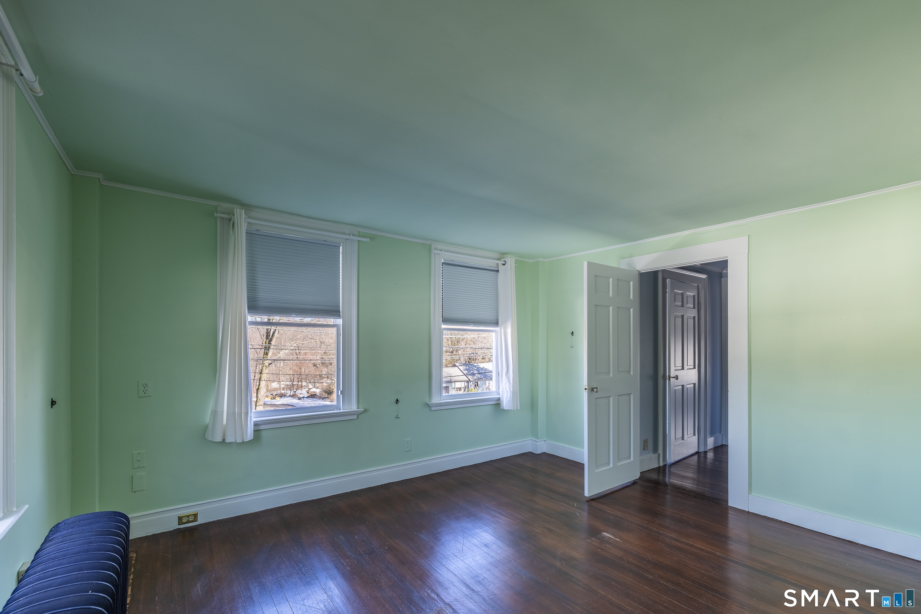 5385 Main Street Trumbull, CT 06611 - Photo 24 of 39 an empty room with wooden floor closet and windows