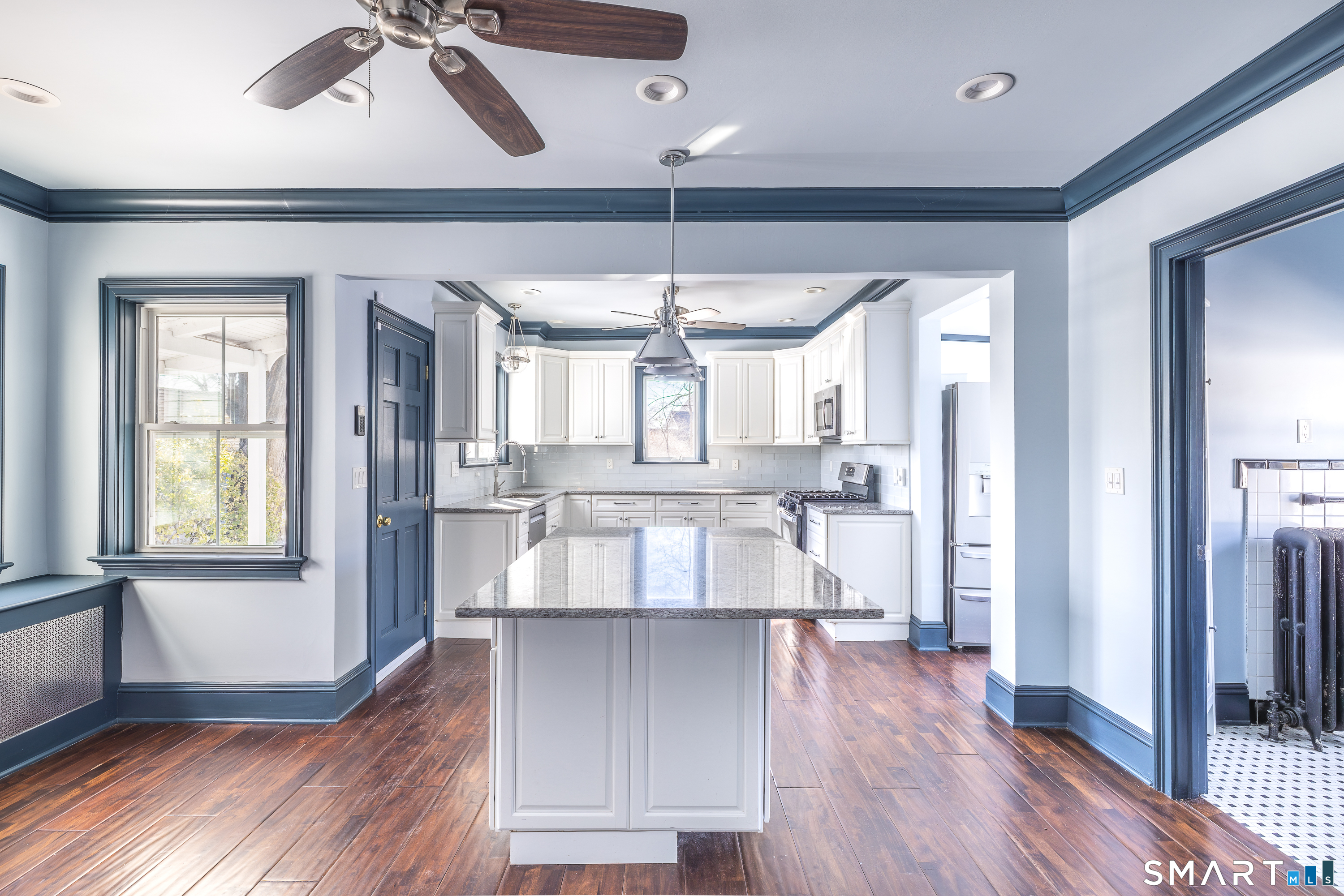5385 Main Street Trumbull, CT 06611 - Photo 3 of 39 a view of a living room and kitchen with wooden floor