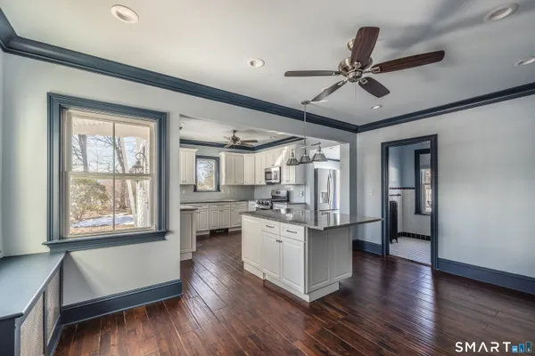 a kitchen with a stove a sink and a refrigerator