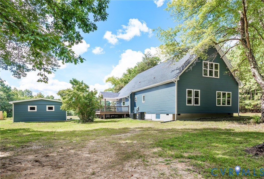 10601 Beaver Bridge Road Chesterfield, VA 23838 - Photo 38 of 39 Modern farmhouse exterior with teal siding and whi