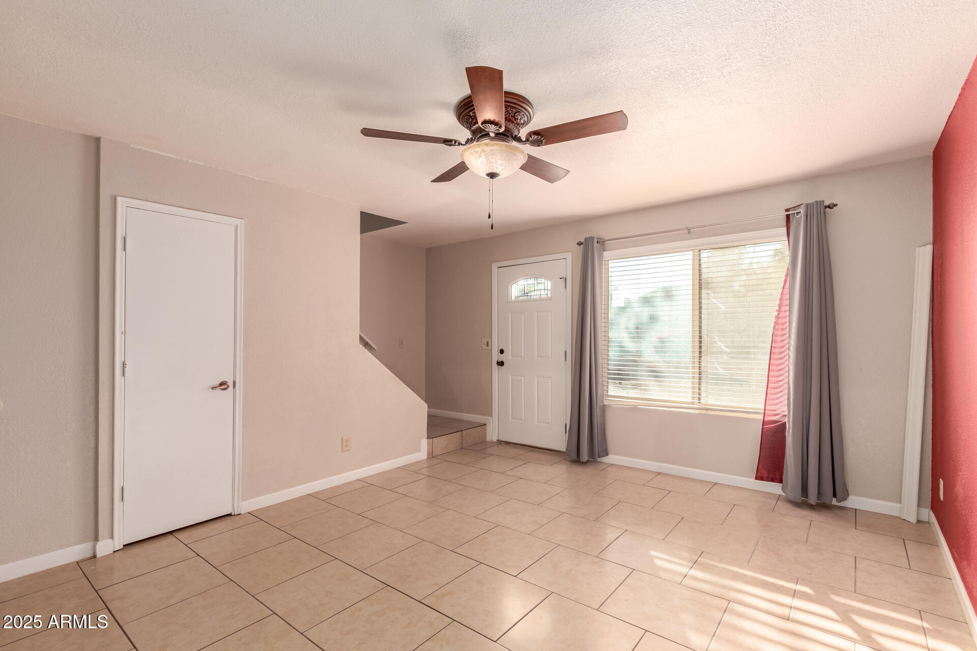 19601 North 7th Street, Unit 1063 Phoenix, AZ 85024 - Photo 5 of 26 a view of an empty room with a window