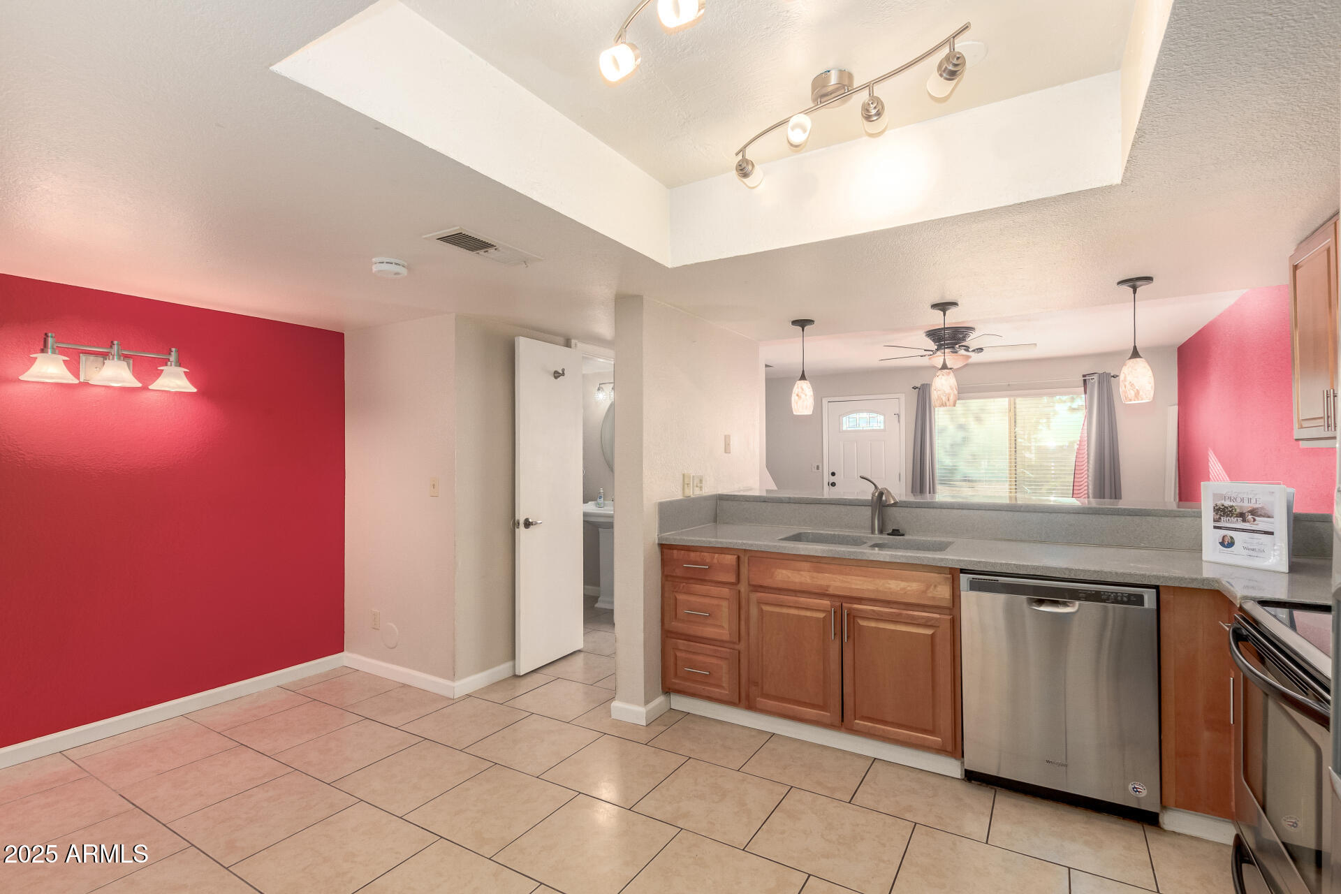 19601 North 7th Street, Unit 1063 Phoenix, AZ 85024 - Photo 7 of 26 a large kitchen with a sink and dishwasher a stove with wooden floor
