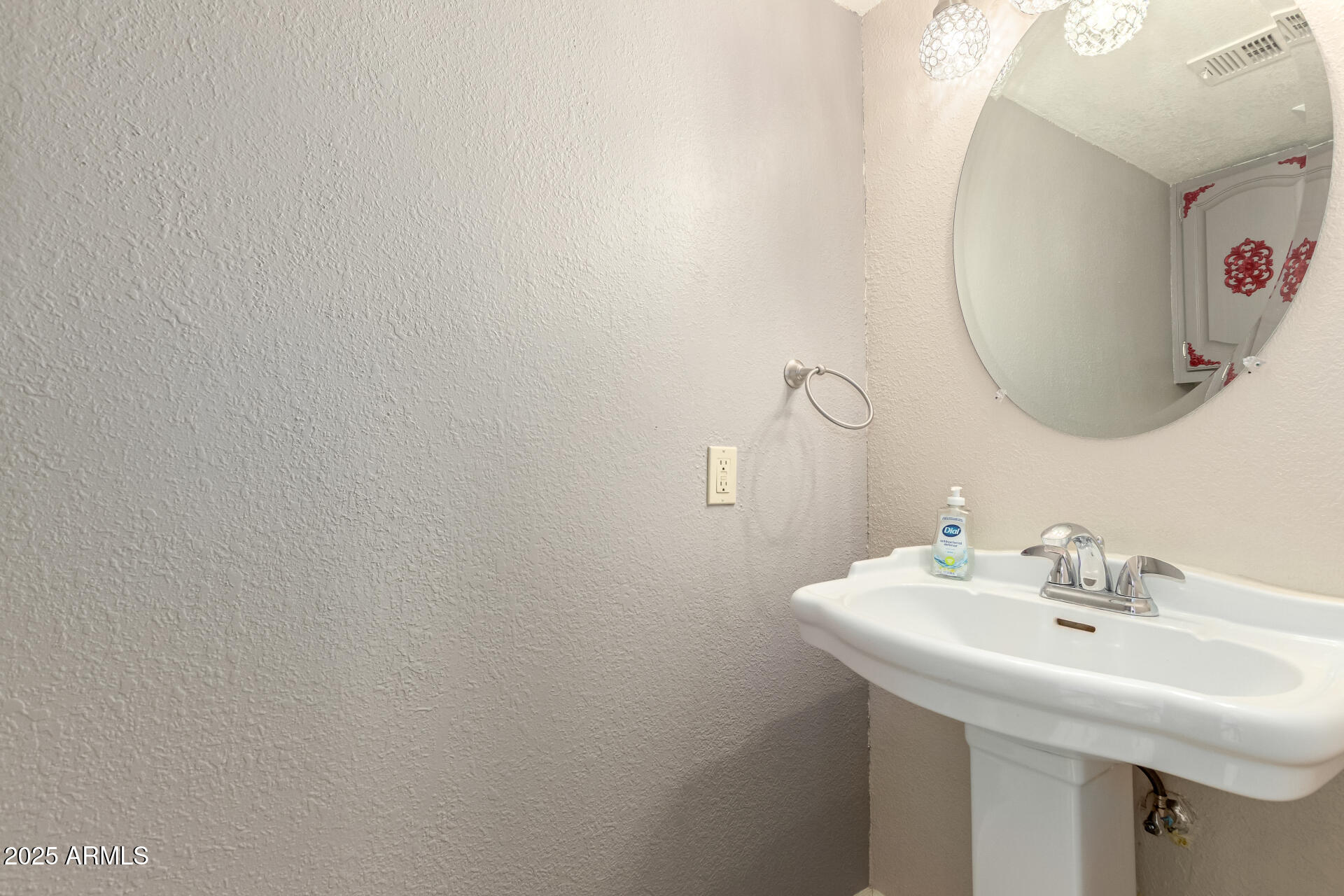 19601 North 7th Street, Unit 1063 Phoenix, AZ 85024 - Photo 10 of 26 a bathroom with a sink and a mirror