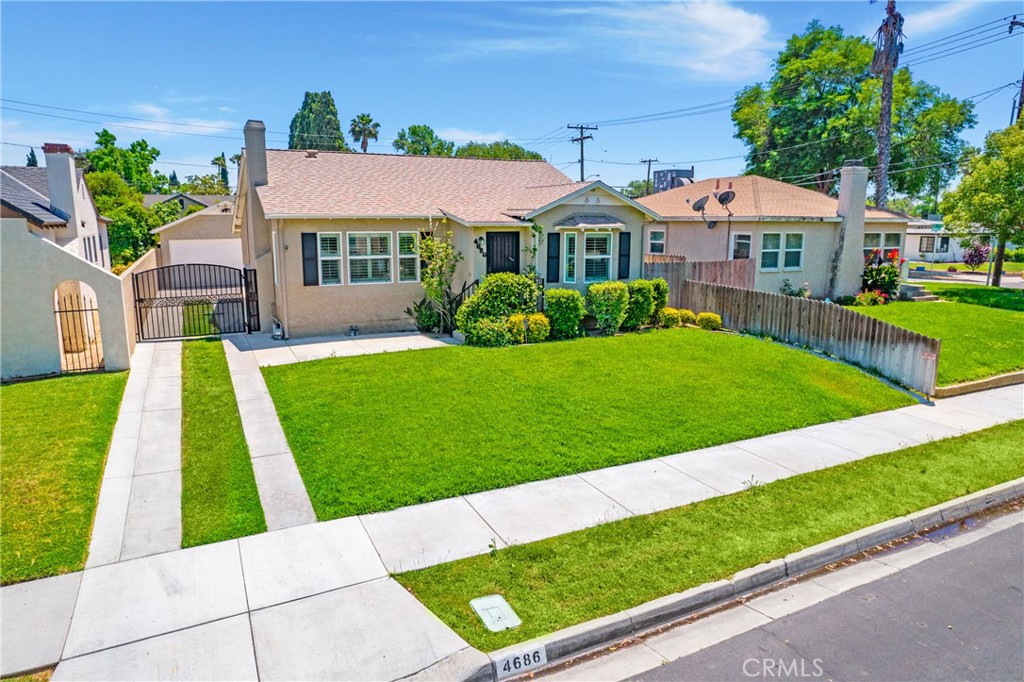 4686 Merrill Avenue Riverside, CA 92506 - Photo 1 of 1 a front view of a house with a yard