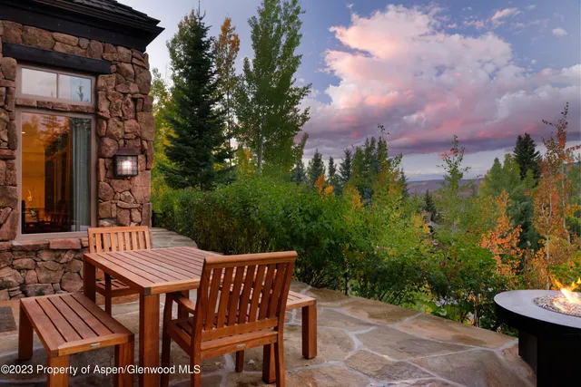 a view of a backyard with sitting area