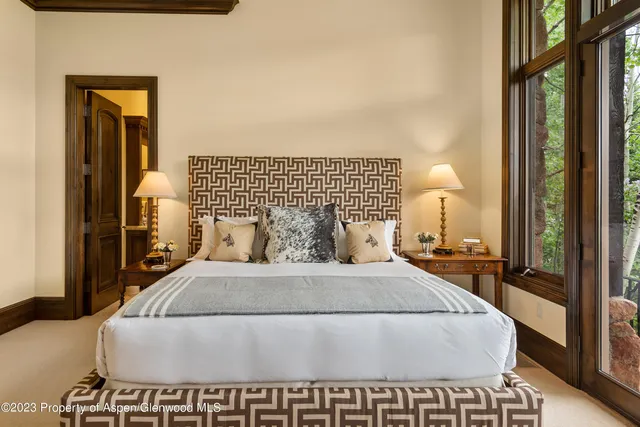 a view of a workspace with furniture and a flat screen tv