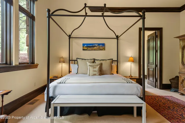 a bedroom with a bed and a couch