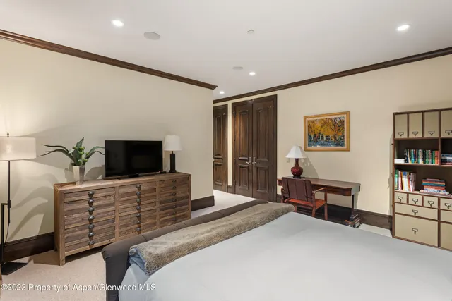 a living room with furniture a rug and a large window