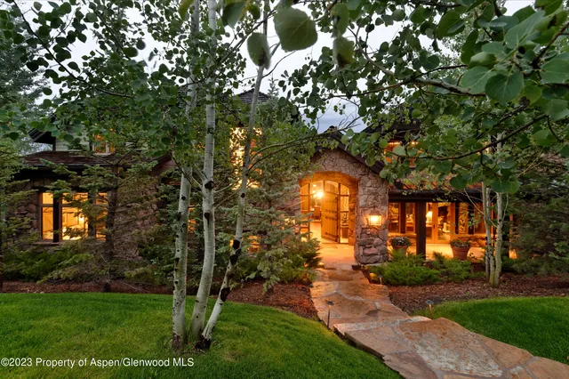 an aerial view of a house with mountain view