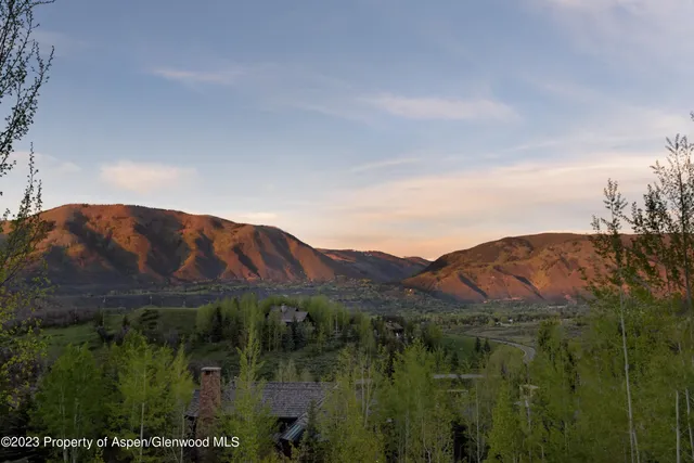 a view of a house with a big yard