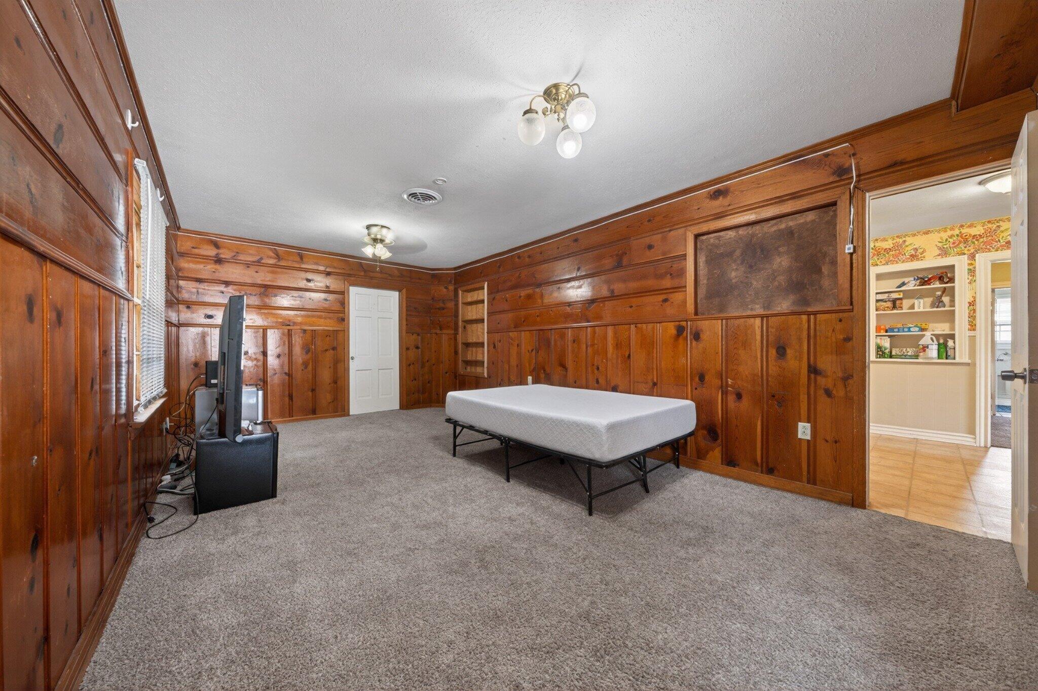 2212 22nd Street Lubbock, TX 79411 - Photo 7 of 14 a view of a room with furniture and chandelier