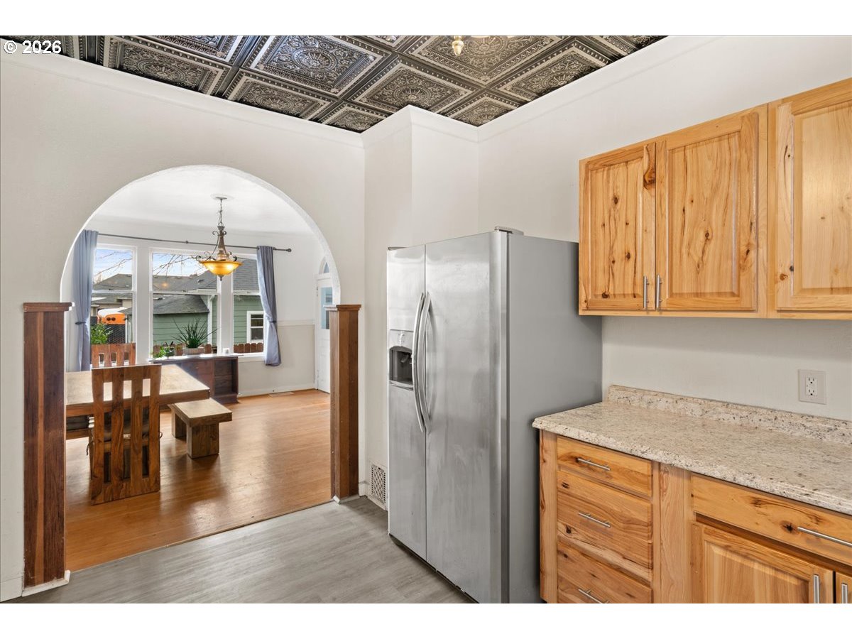 1280 4th Street Northeast Salem, OR 97301 - Photo 14 of 44 a kitchen with stainless steel appliances granite countertop a refrigerator and a sink