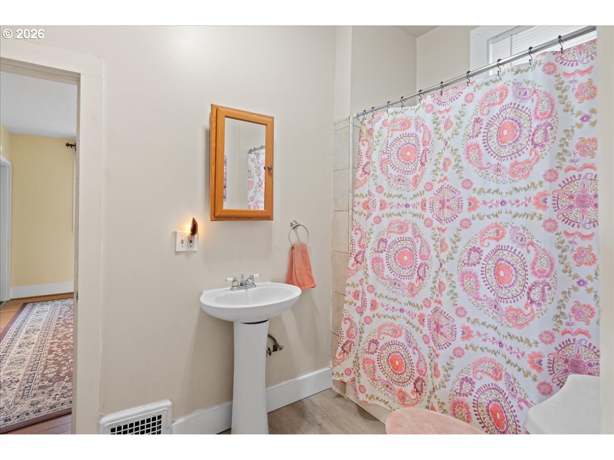 1280 4th Street Northeast Salem, OR 97301 - Photo 23 of 44 a bathroom with a sink and a mirror