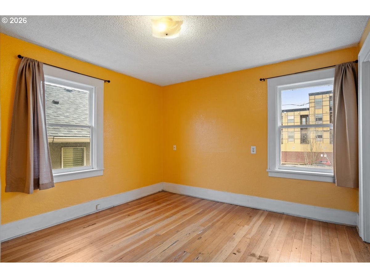 1280 4th Street Northeast Salem, OR 97301 - Photo 27 of 44 a view of an empty room with wooden floor and a window