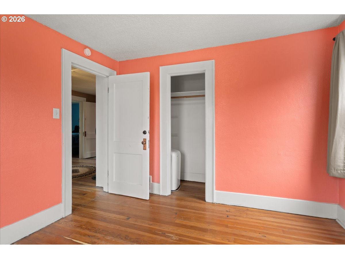 1280 4th Street Northeast Salem, OR 97301 - Photo 30 of 44 a view of an empty room with wooden floor and closet