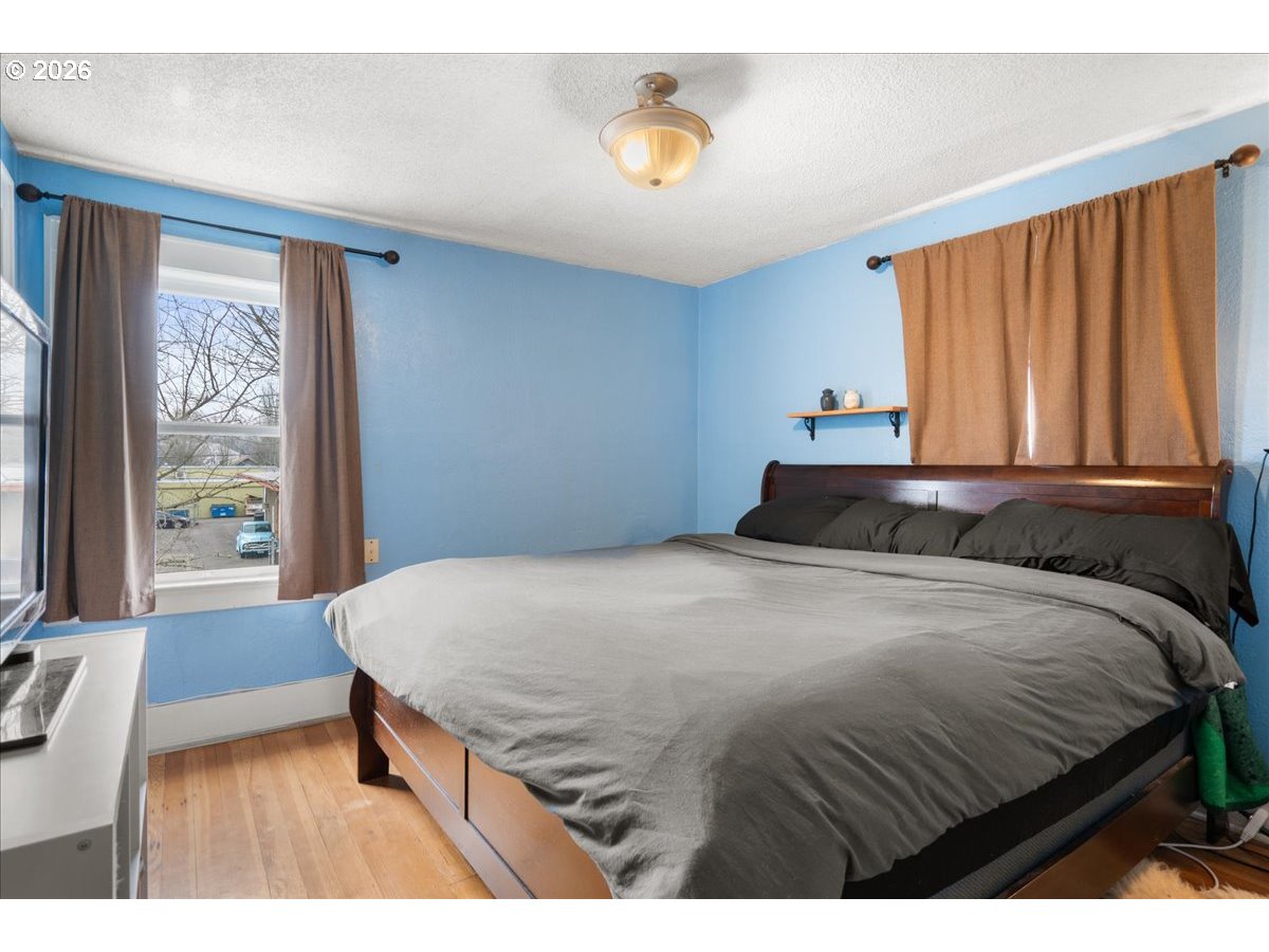 1280 4th Street Northeast Salem, OR 97301 - Photo 35 of 44 a bedroom with a bed and window