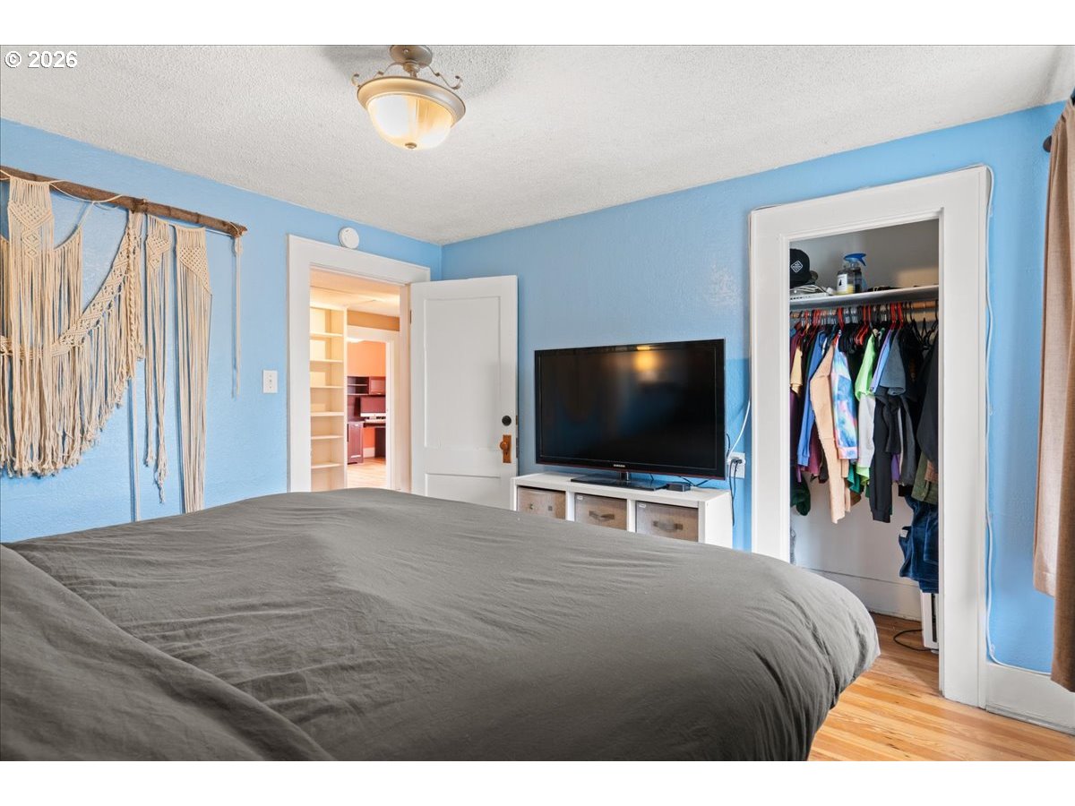 1280 4th Street Northeast Salem, OR 97301 - Photo 36 of 44 a bedroom with a bed and a flat screen tv