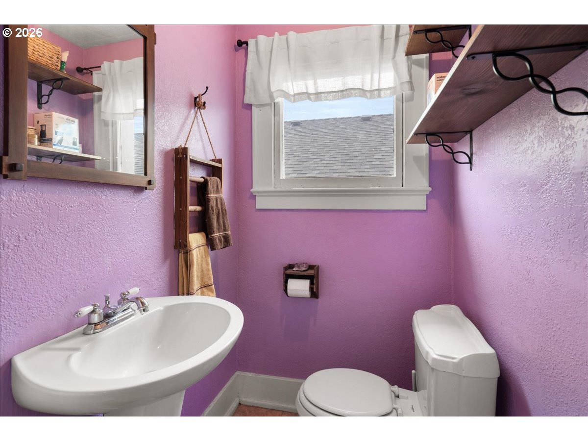1280 4th Street Northeast Salem, OR 97301 - Photo 37 of 44 a bathroom with a sink mirror and toilet