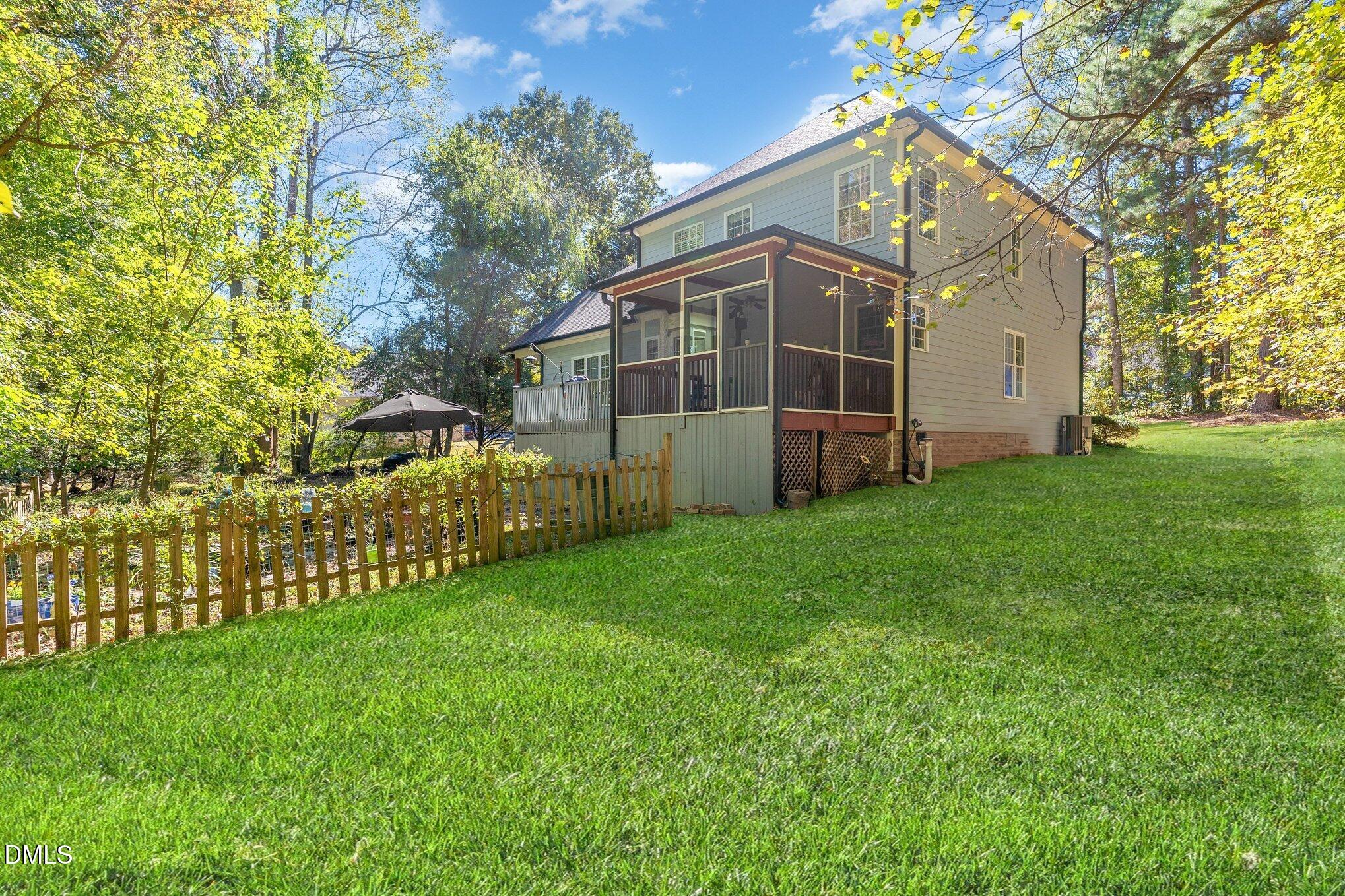 4613 Cherrybark Lane Raleigh, NC 27616 - Photo 22 of 27 a view of a house with a yard and sitting area