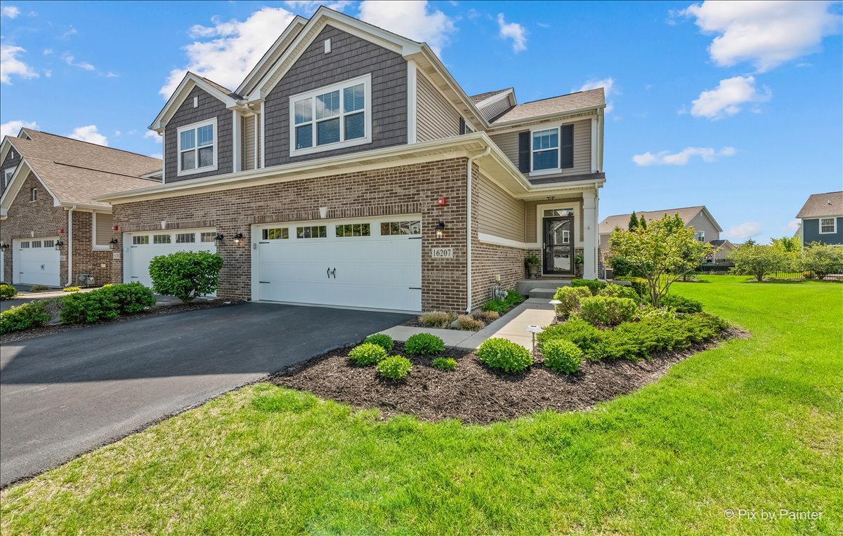 a front view of a house with a yard