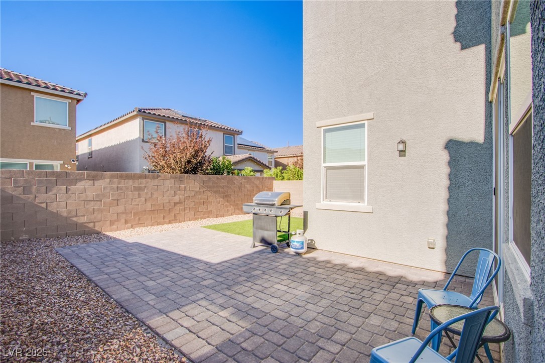 9858 West Meranto Avenue Las Vegas, NV 89178 - Photo 35 of 36 Fenced backyard featuring a patio and a grill