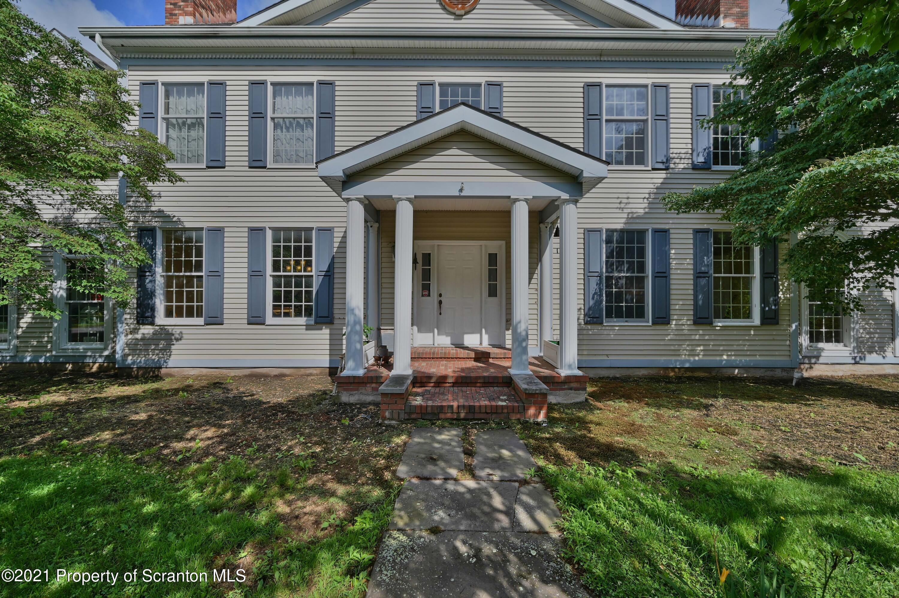 454 Twin Rocks Road Sterling, PA 18463 - Photo 1 of 102 a front view of a house with a yard