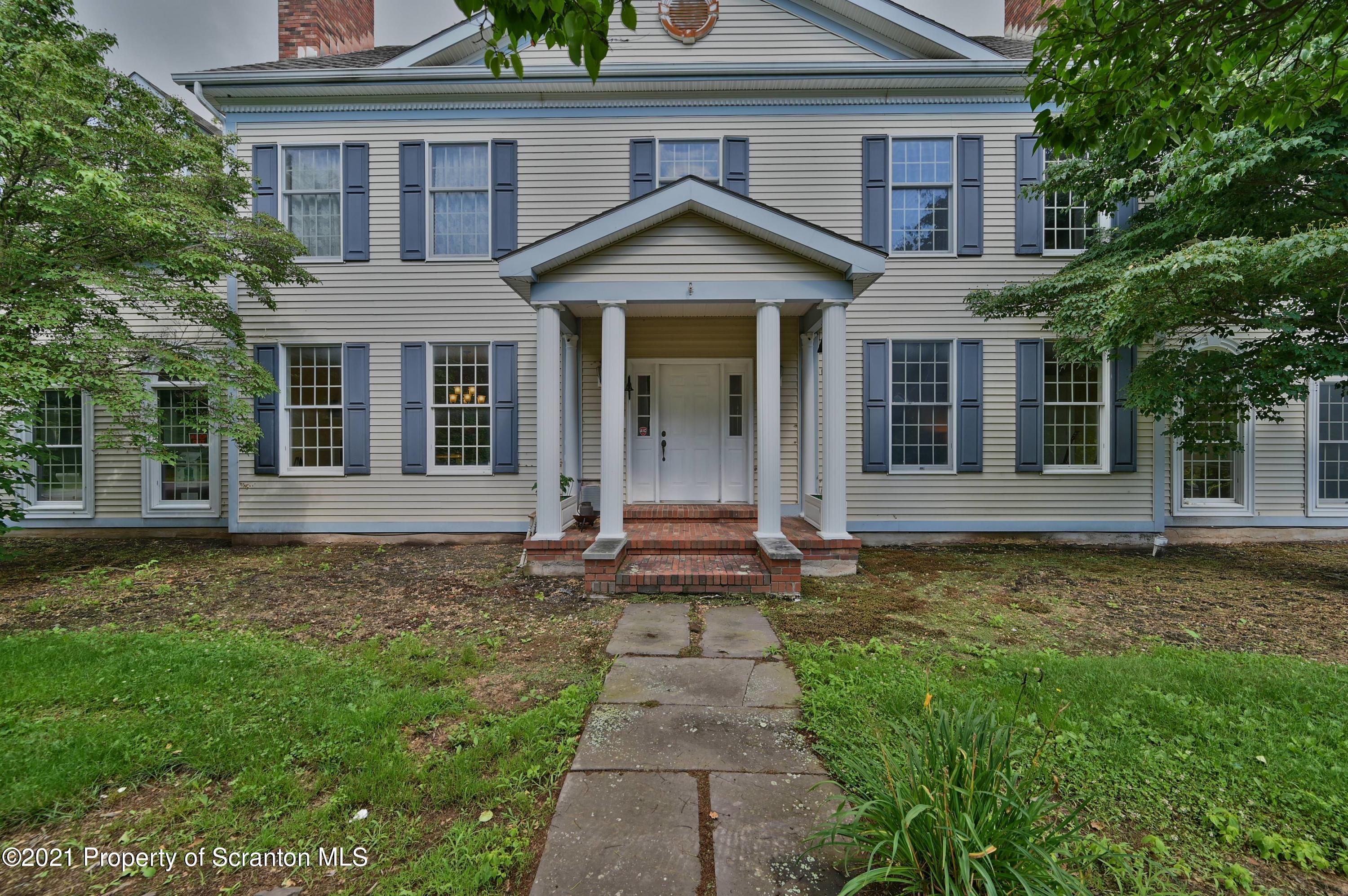 454 Twin Rocks Road Sterling, PA 18463 - Photo 16 of 102 a front view of a house with a garden