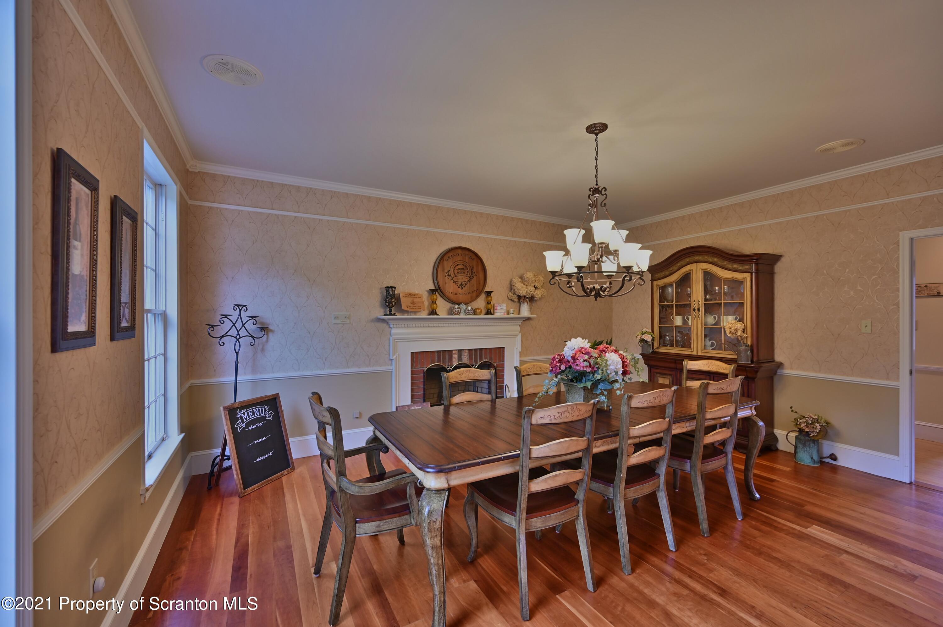 454 Twin Rocks Road Sterling, PA 18463 - Photo 19 of 102 a view of a dining room with furniture wooden floor and chandelier