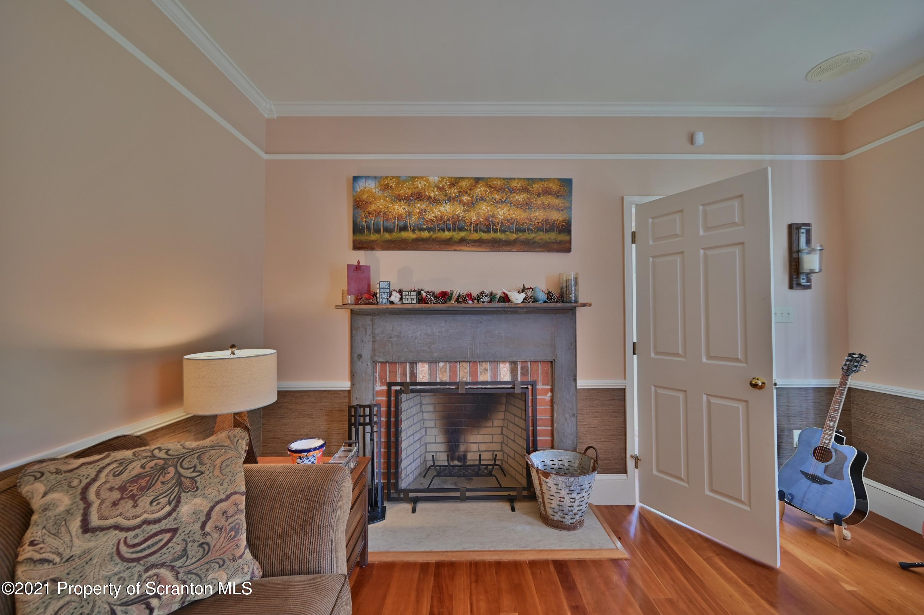 454 Twin Rocks Road Sterling, PA 18463 - Photo 23 of 102 a living room with furniture and a fireplace