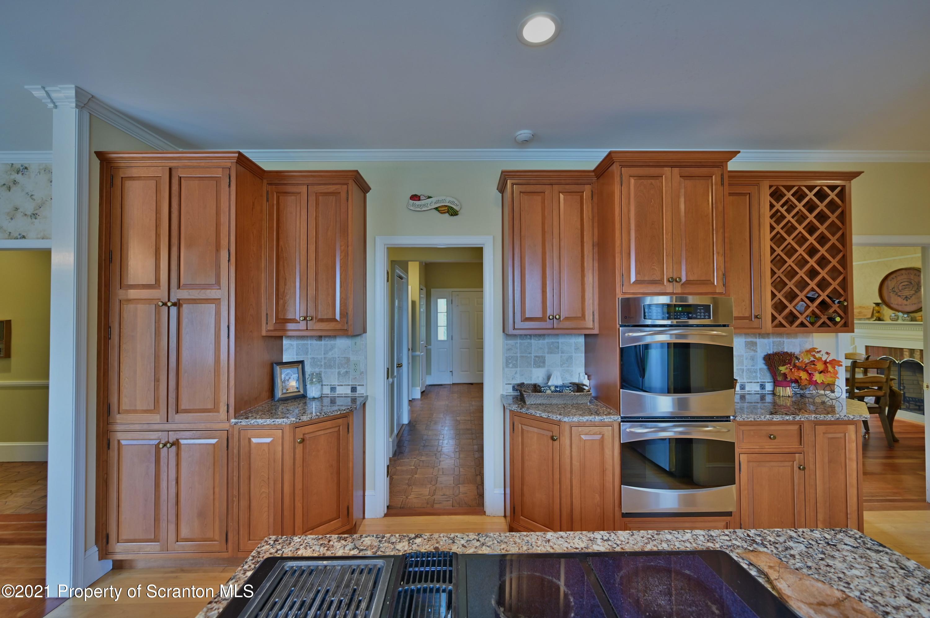 454 Twin Rocks Road Sterling, PA 18463 - Photo 34 of 102 a kitchen with stainless steel appliances granite countertop a refrigerator and wooden cabinets