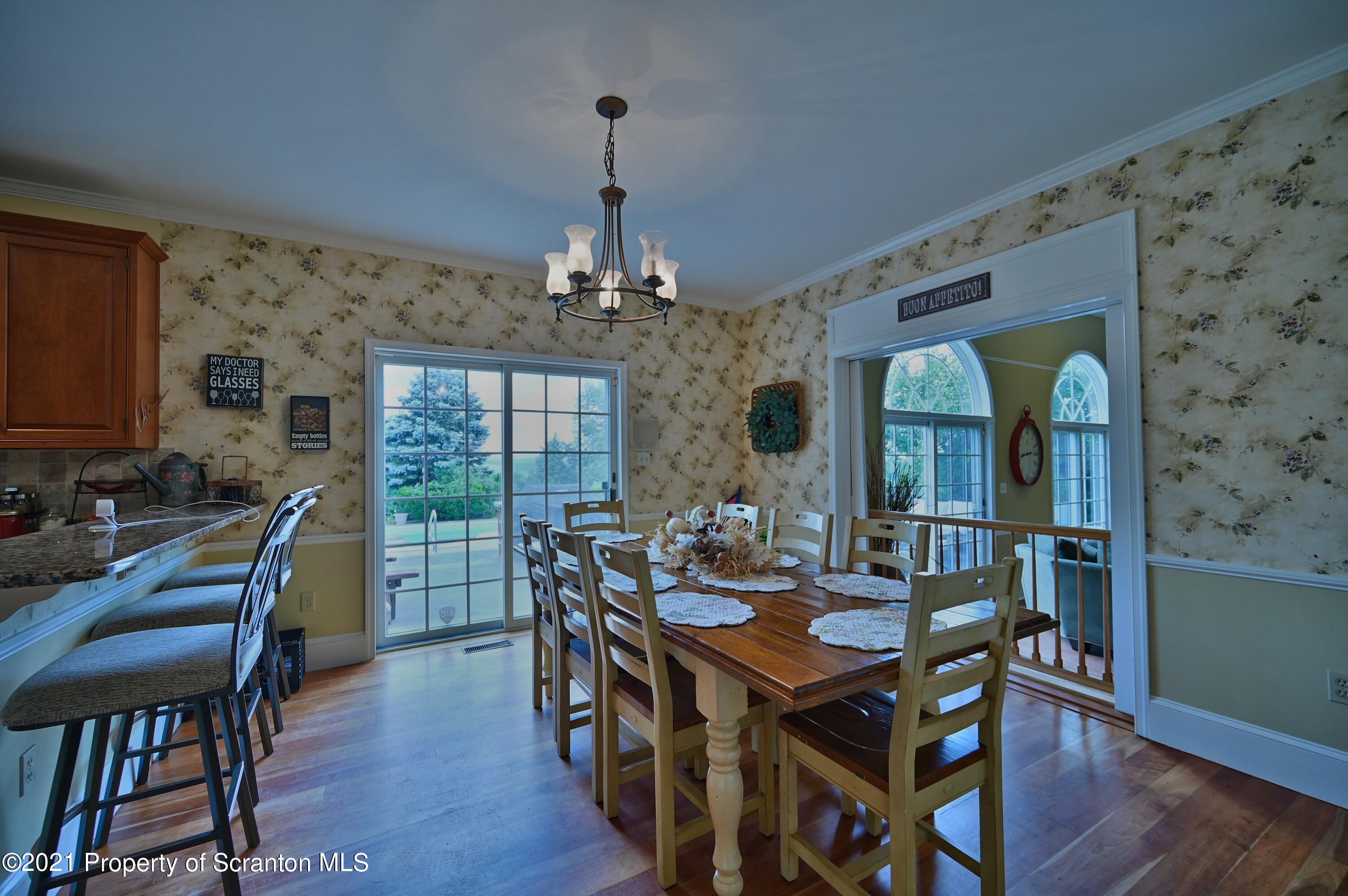 454 Twin Rocks Road Sterling, PA 18463 - Photo 36 of 102 a view of a dining room with furniture window and wooden floor