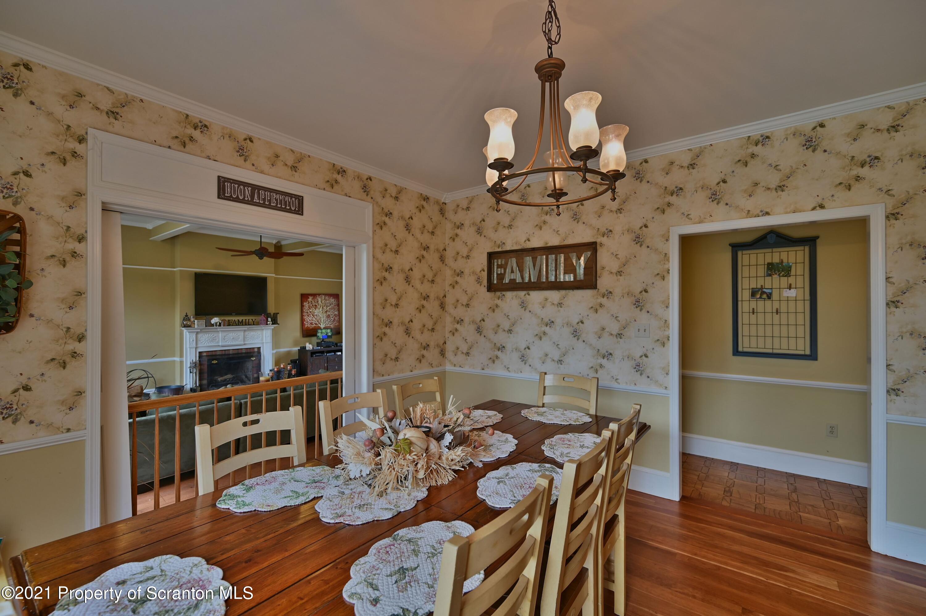 454 Twin Rocks Road Sterling, PA 18463 - Photo 38 of 102 a view of a dining room with furniture wooden floor and a chandelier
