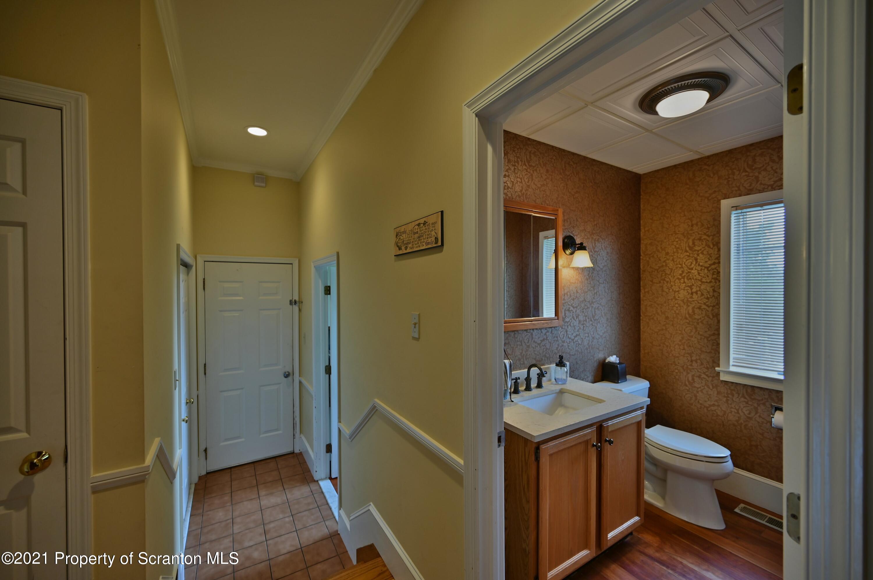 454 Twin Rocks Road Sterling, PA 18463 - Photo 39 of 102 a bathroom with a toilet sink a mirror and shower