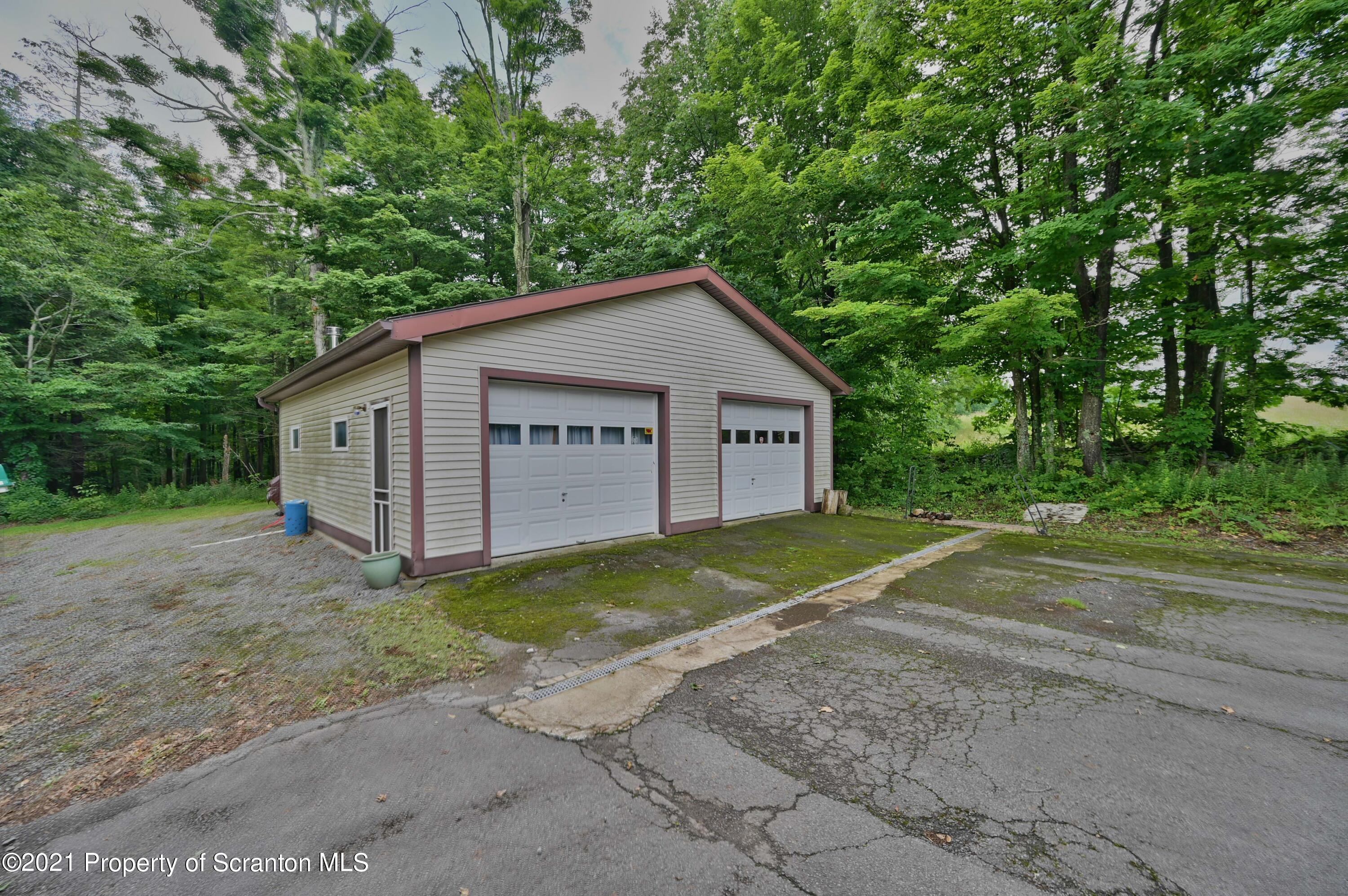 454 Twin Rocks Road Sterling, PA 18463 - Photo 65 of 102 a view of a house with backyard and trees