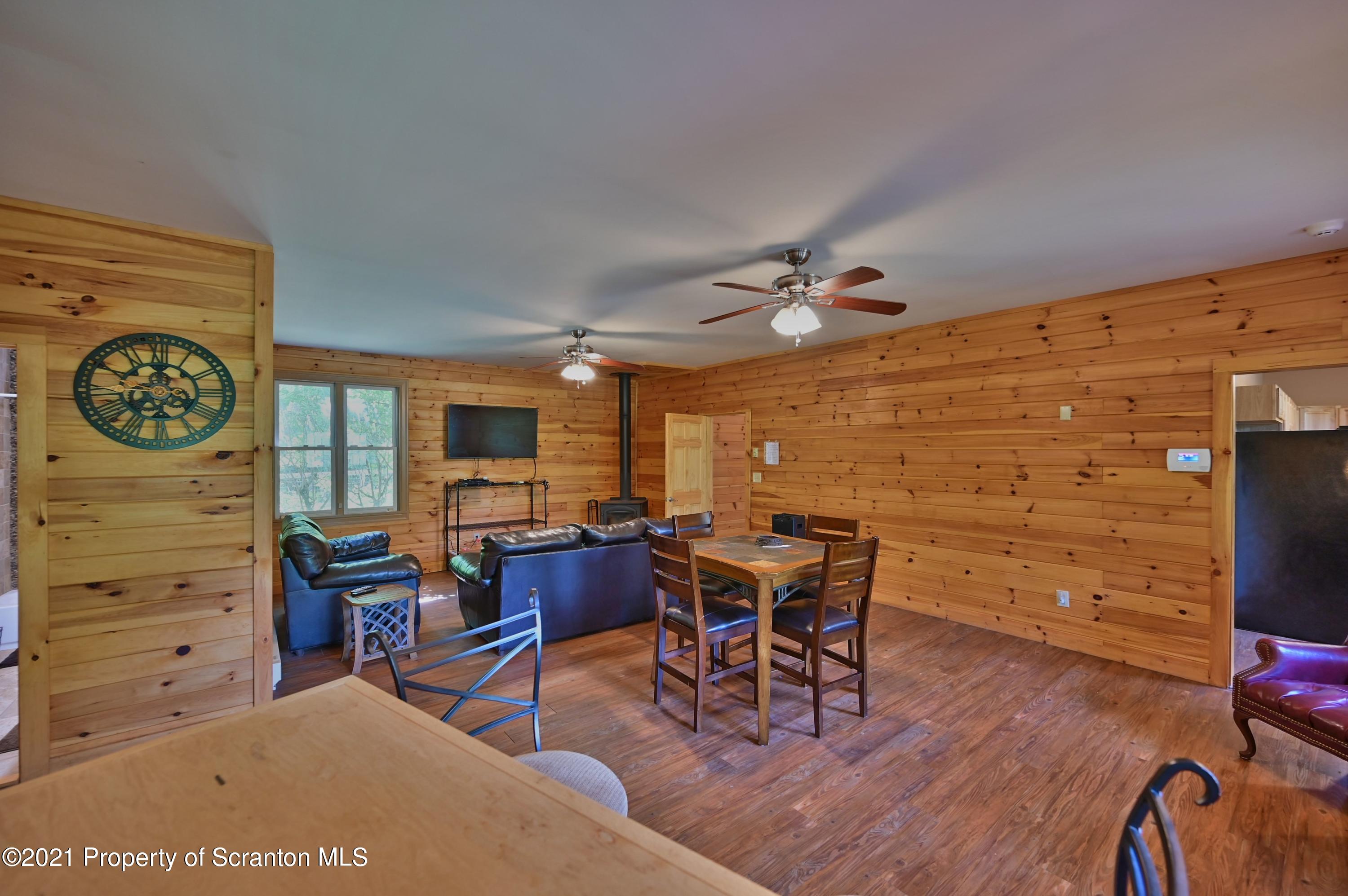 454 Twin Rocks Road Sterling, PA 18463 - Photo 68 of 102 a view of a livingroom with furniture window and wooden floor