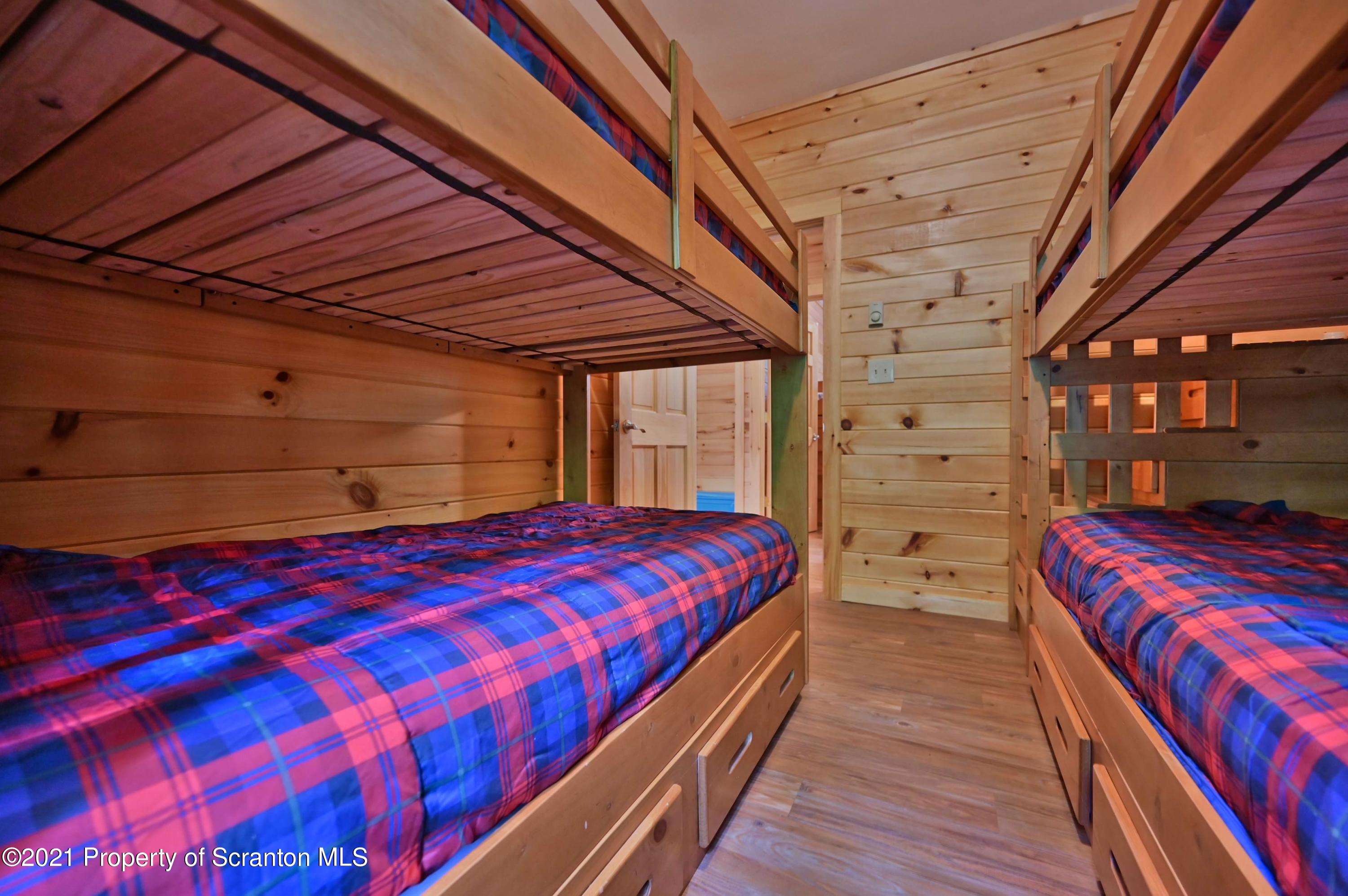 454 Twin Rocks Road Sterling, PA 18463 - Photo 81 of 102 a bed sitting in a bedroom next to a larger window