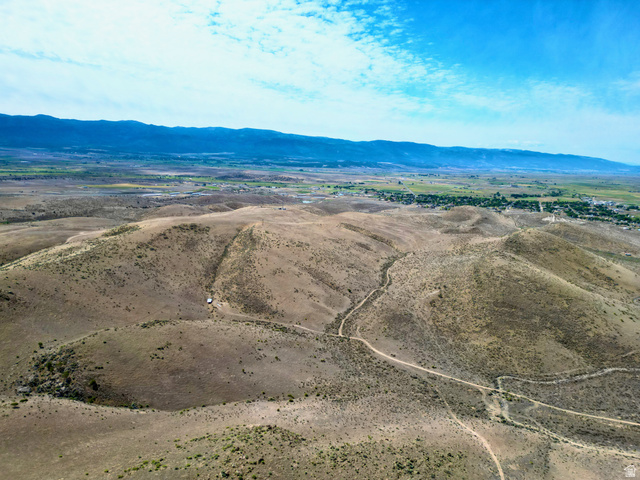 600 East E Street Moroni, UT 84646 - Photo 25 of 38 Expansive arid landscape featuring rolling hills and distant mountainous terrain