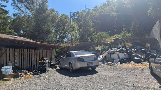 a view of a backyard patio and fire pit