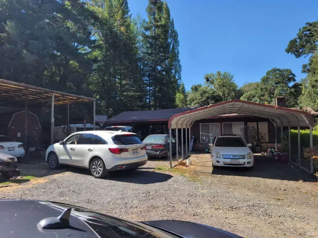 a front view of a house with parking space