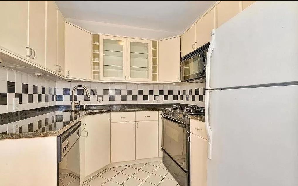 80 Bloomfield Street, Unit 4B Hoboken, NJ 07030 - Photo 2 of 11 a kitchen with stainless steel appliances granite countertop a sink stove and refrigerator
