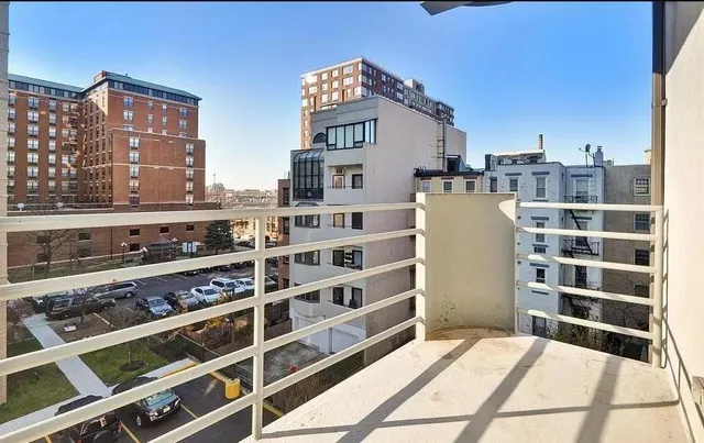 a view of a kitchen with a large window