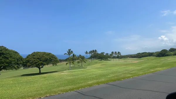a view of a golf course with a lake
