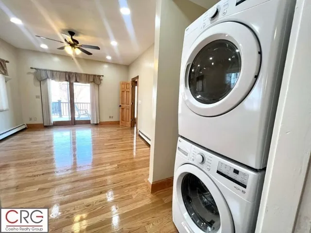 a view of a hallway with washer and dryer