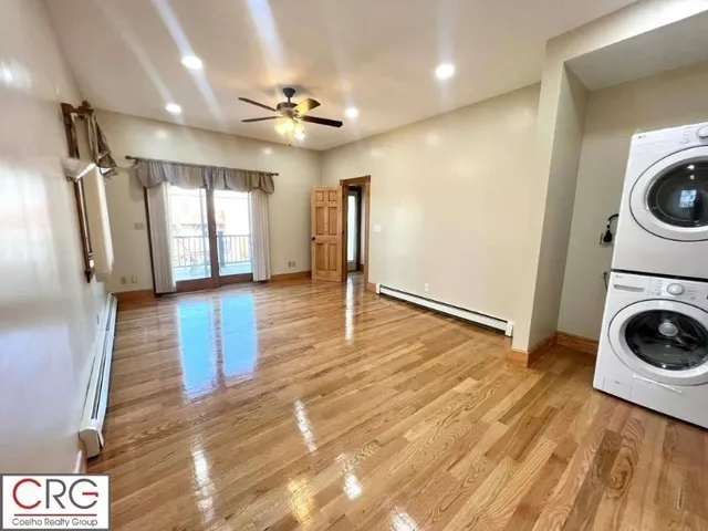 a view of a storage & utility room with wooden floor