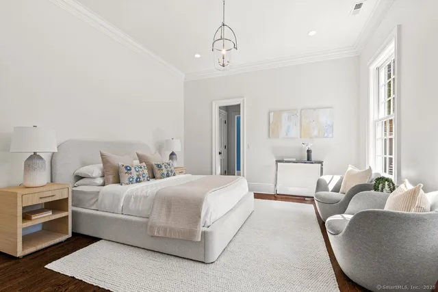 a bedroom with bed and window