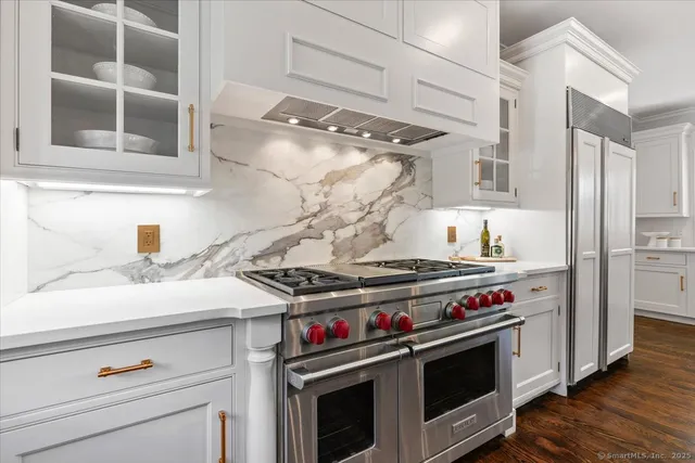 a kitchen with a stove and a sink