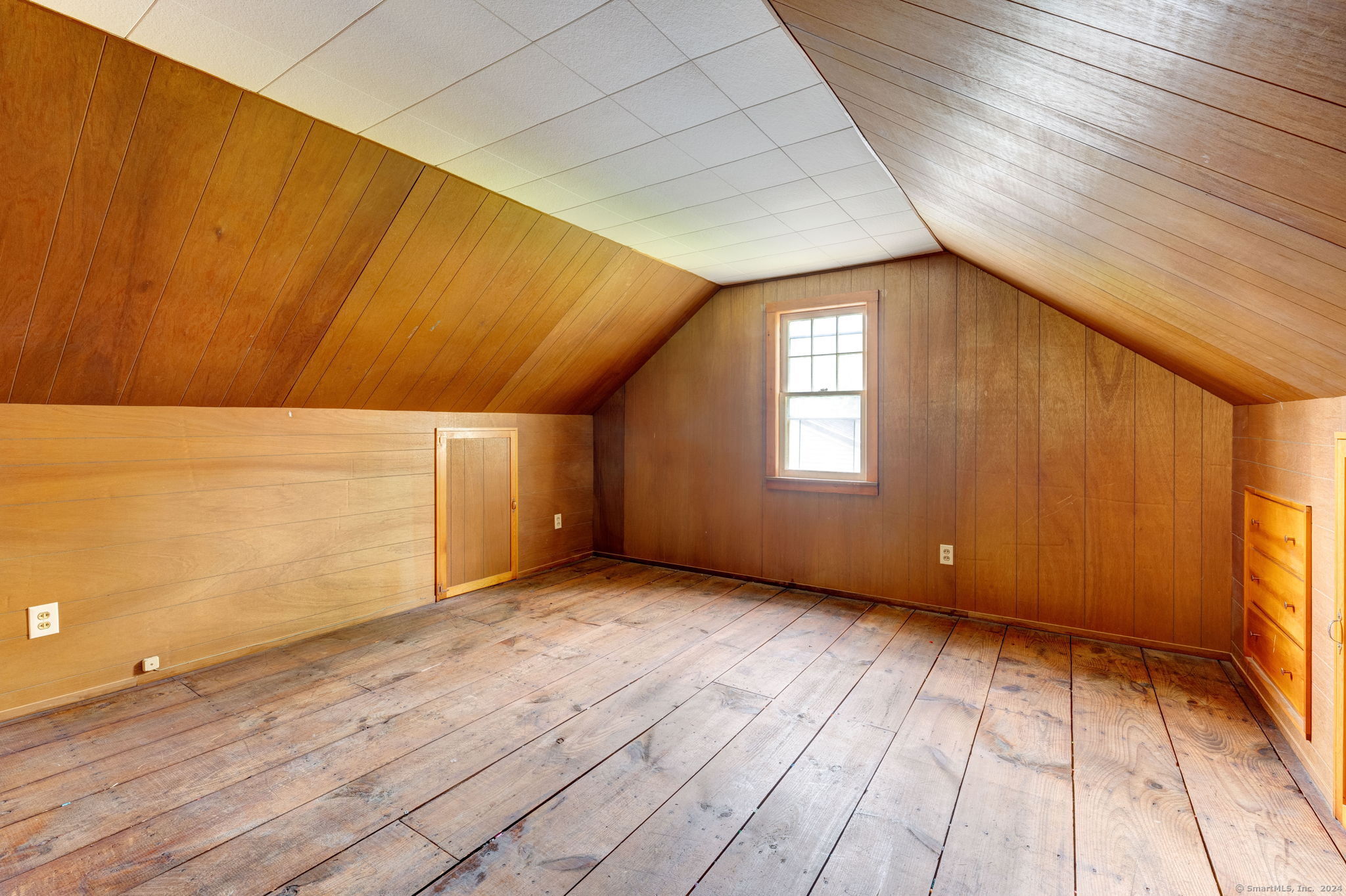 40 Mortimer Street, Unit 3 Torrington, CT 06790 - Photo 14 of 20 a view of an empty room with window and wooden floor