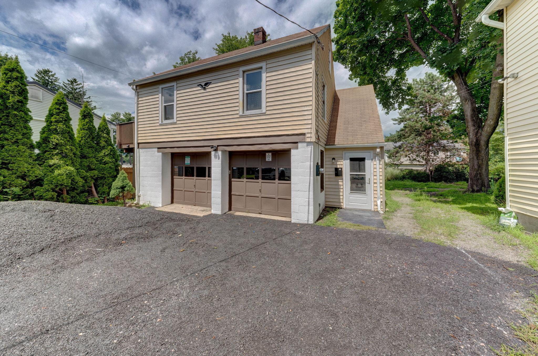 40 Mortimer Street, Unit 3 Torrington, CT 06790 - Photo 2 of 20 a view of a house with a yard and large tree